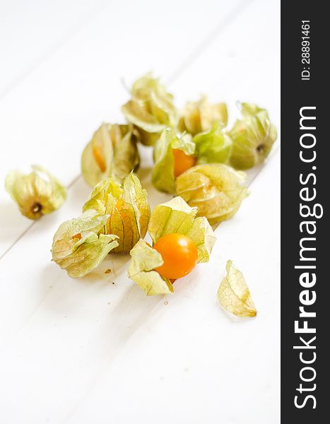 Cape Gooseberry- Physalis peruviana on a white wooden table