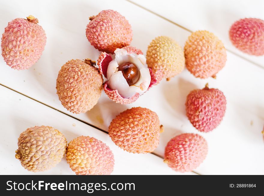 Fresh litchis on a white table. Fresh litchis on a white table