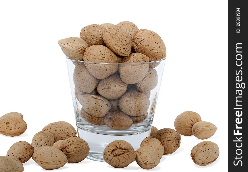 Cup with almonds on white background