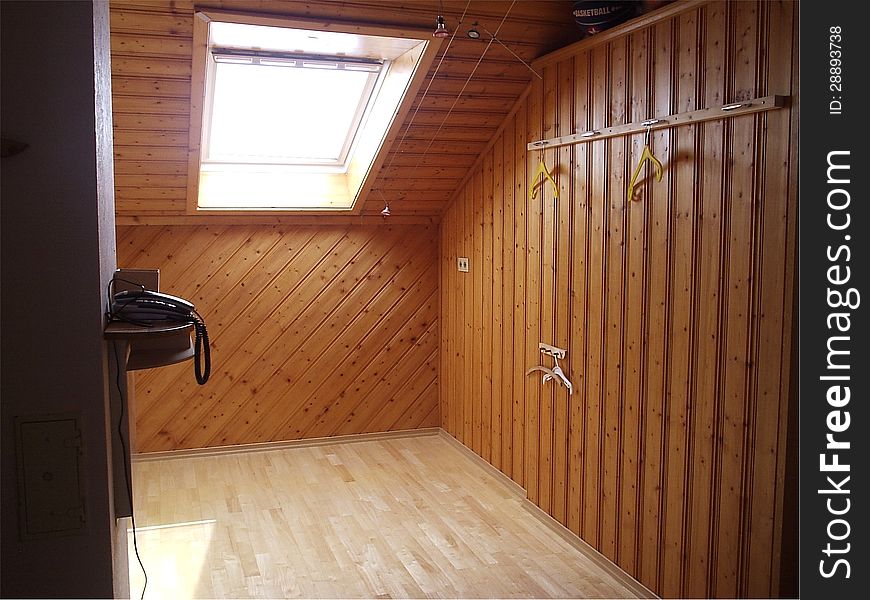 Room with wooden walls and sun window. Room with wooden walls and sun window