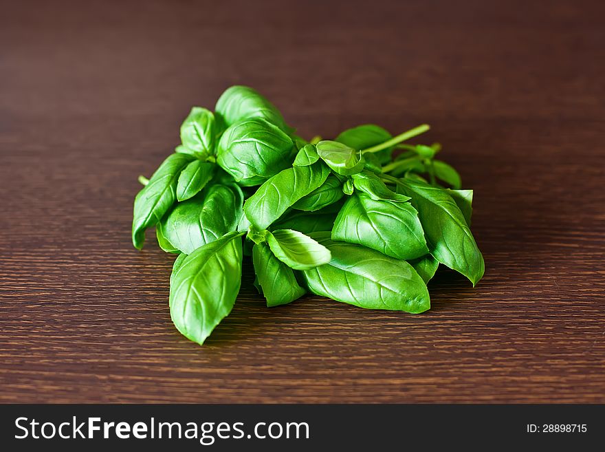 Close-up heap of green basil on a table