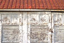 Red Roof White Doors Stock Images