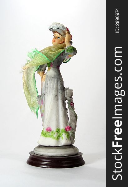 Figurine of a lady with green scarf. Figurine of a lady with green scarf