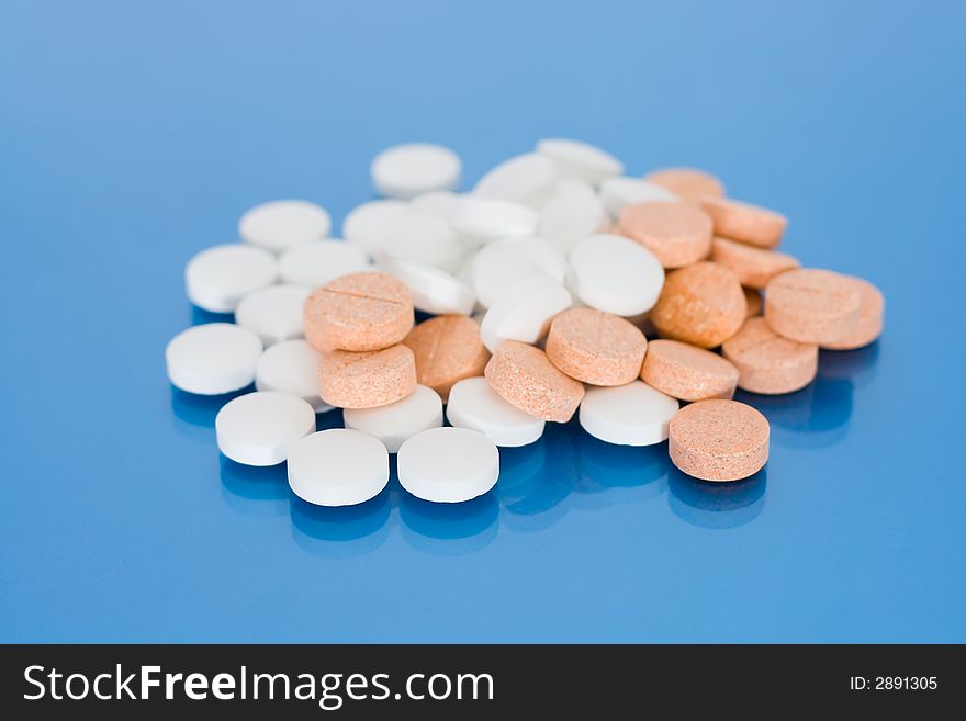 The written out tablets laying on a table on a background