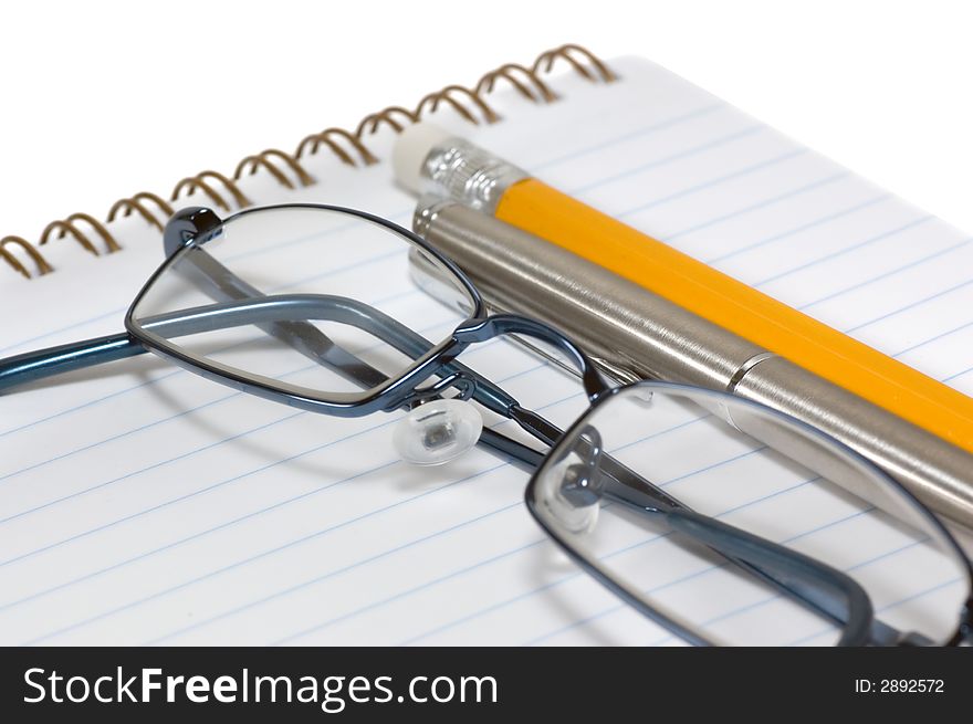 Eyeglasses On Open Notepad