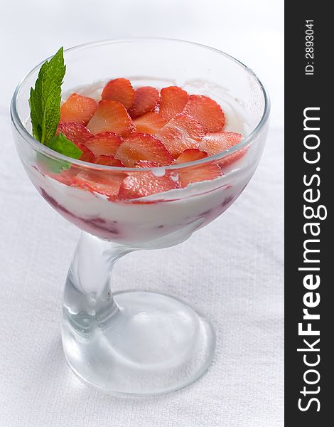 Ice-cream with strawberry in vase