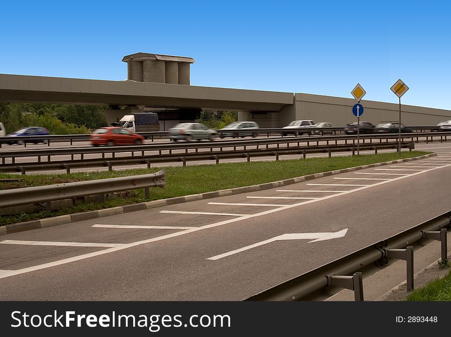 Cars move on highway at high speed