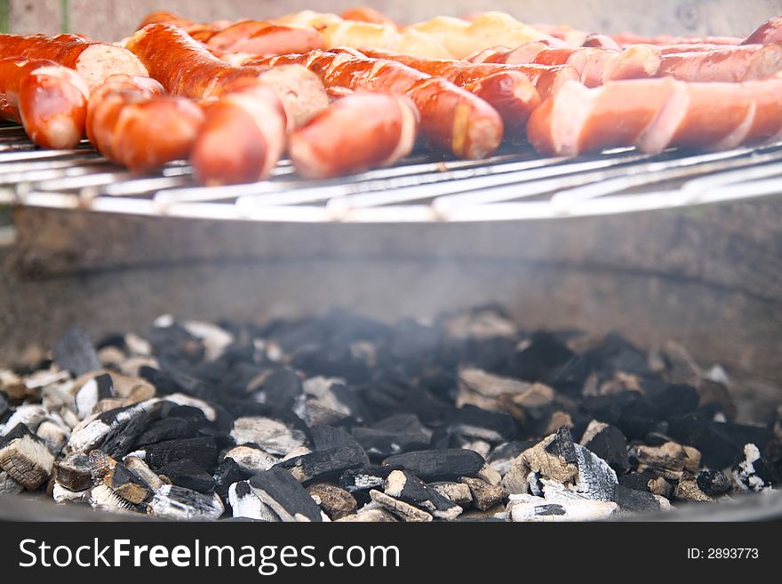 Barbecue time... sausage on grill