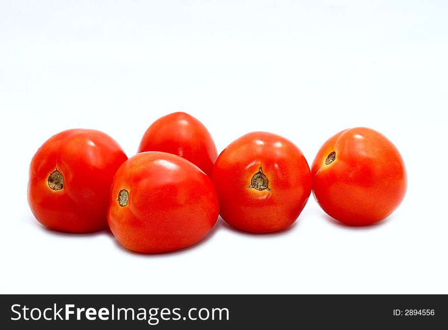 Tropical red tomatoes on white
