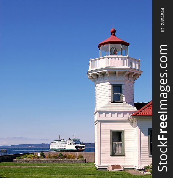 Lighthouse and a boat in the pacific northwest. Lighthouse and a boat in the pacific northwest