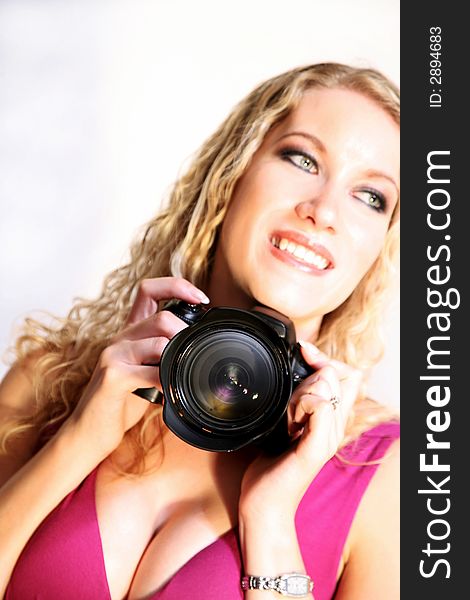 Happy smiling woman photographer on whte. Happy smiling woman photographer on whte