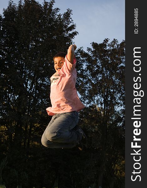 Boy jumping in the air from joy