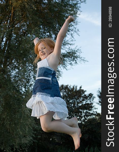 Girl is jumping and cheering from joy. Girl is jumping and cheering from joy