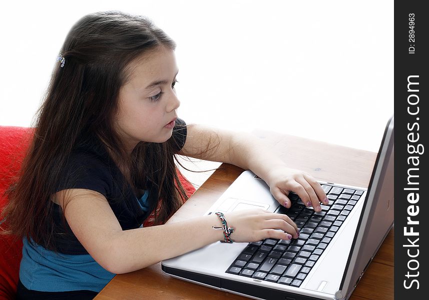 Young girl working on laptop