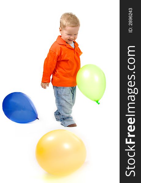 Little boy playing with balloons.