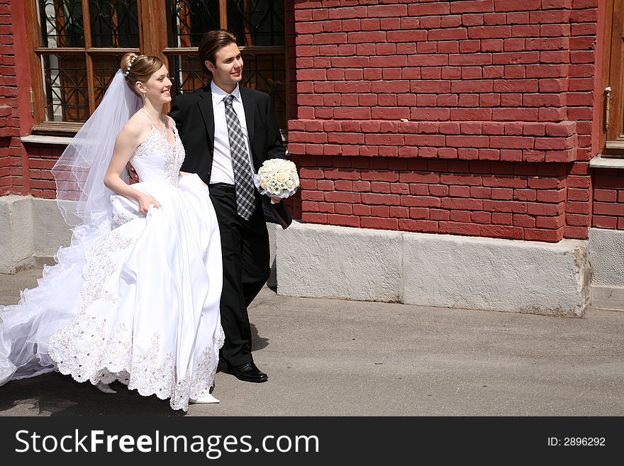 Bride and fiance go on the street