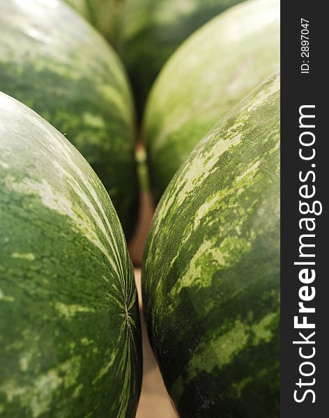 Two watermelons in an outdoor food market