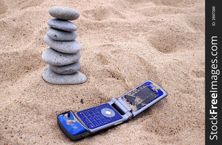 Telephone And Pebble Stack On