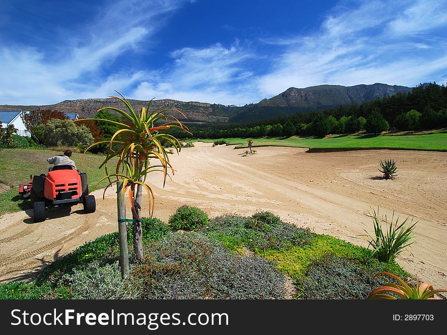 Golf course maintenance on Western Cape golf Course, South Africa. Golf course maintenance on Western Cape golf Course, South Africa