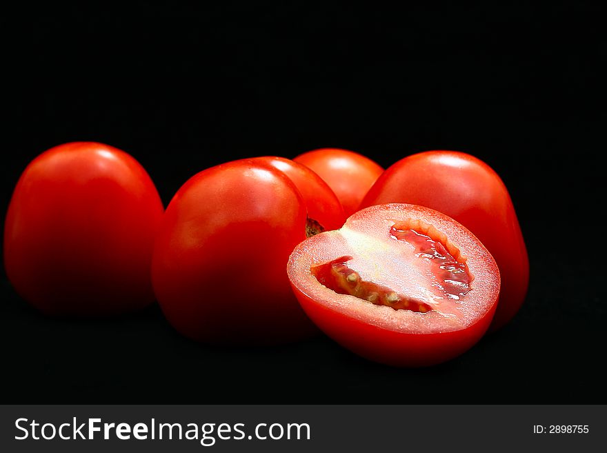 Image fresh tomatoes on black