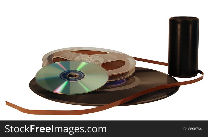 Several examples of audio recording technology including a wax cylinder, 78 rpm phonograph record, reel to reel tape, and a compact disc. Several examples of audio recording technology including a wax cylinder, 78 rpm phonograph record, reel to reel tape, and a compact disc.