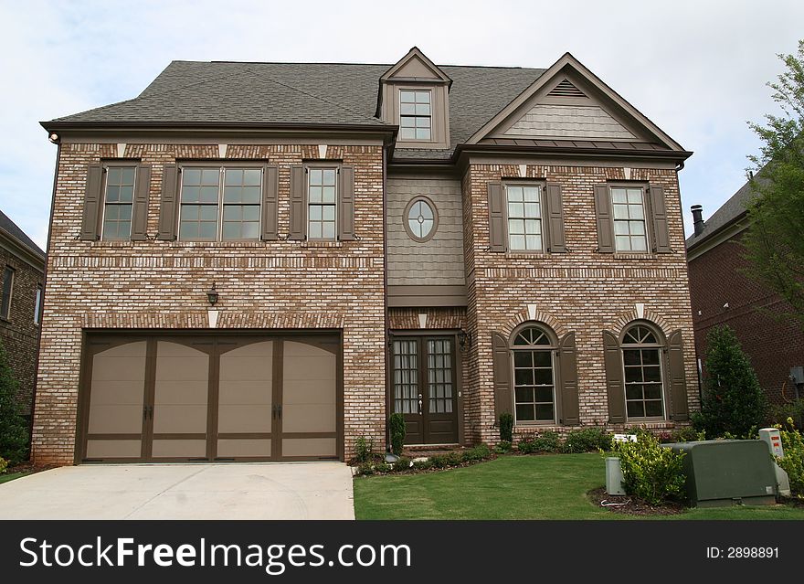 A nice modern brown brick house against the sky. A nice modern brown brick house against the sky