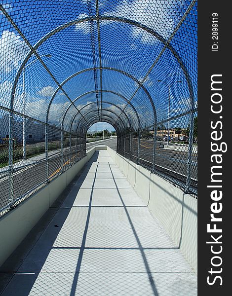 Fenced Walkway On Blue Sky