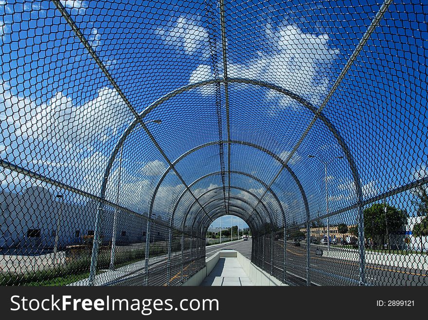 Fenced Walkway on Blue Sky