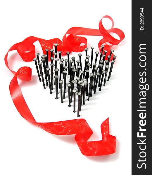 Group of nails as heart on white background