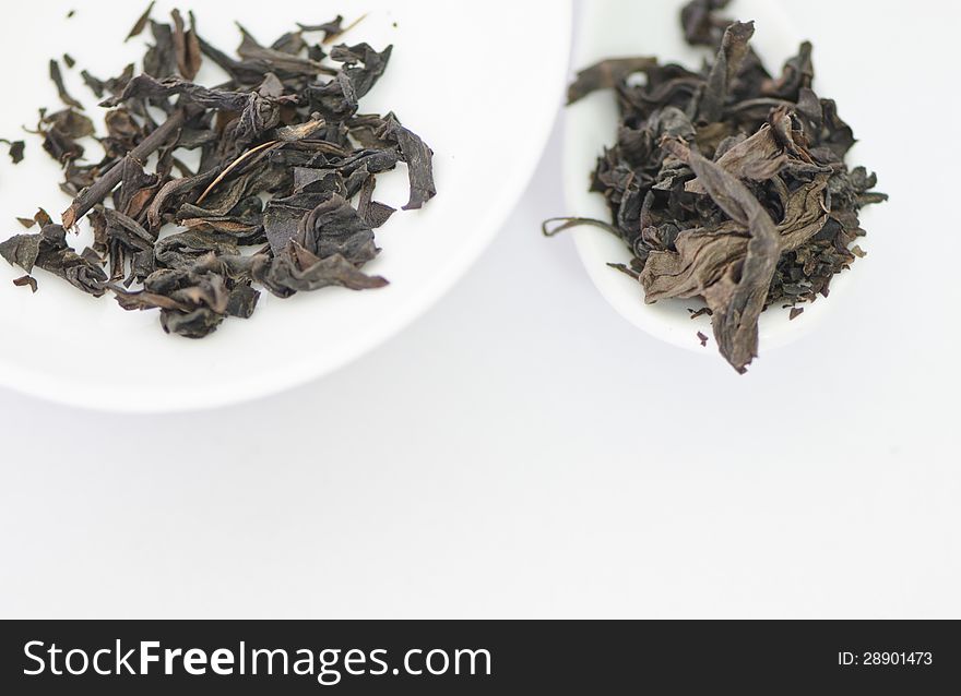 Dry Tea Leaves On A White Background