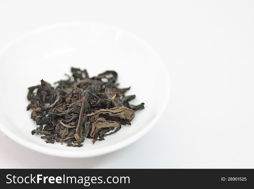 Dry Tea Leaves On A White Background