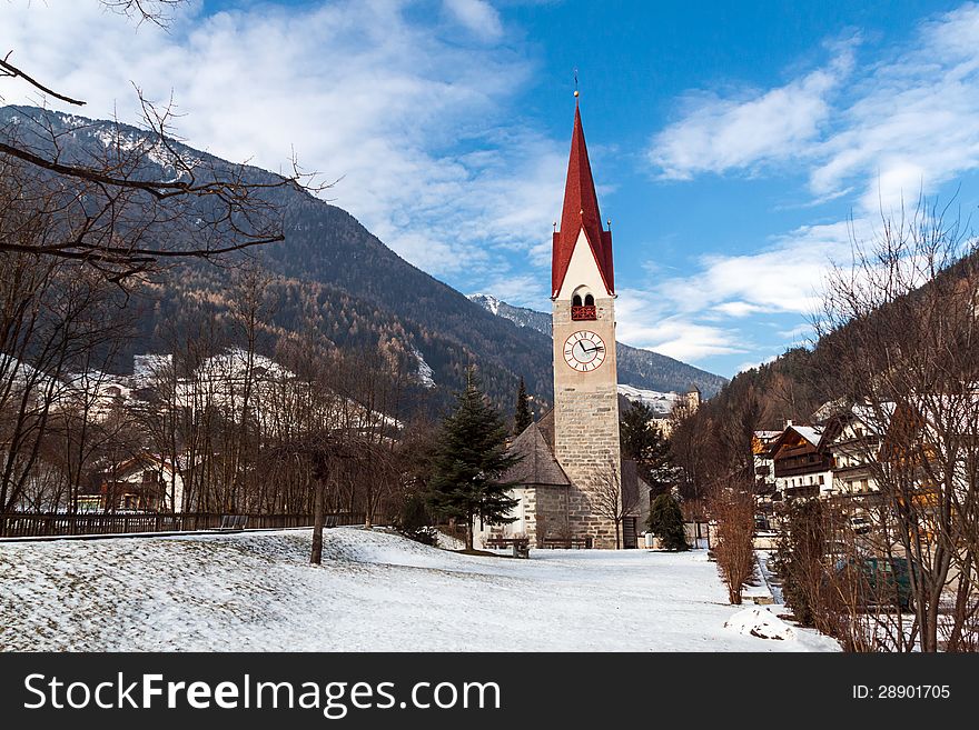 Church with a bell tower on the river Ahr, Campo Tures.