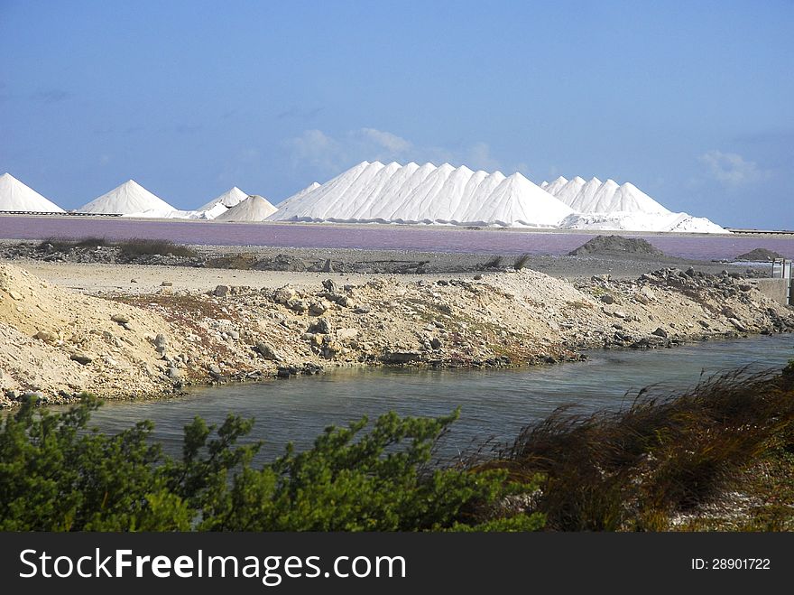 Salt is stored in huge piles on Bonaire. Salt is stored in huge piles on Bonaire