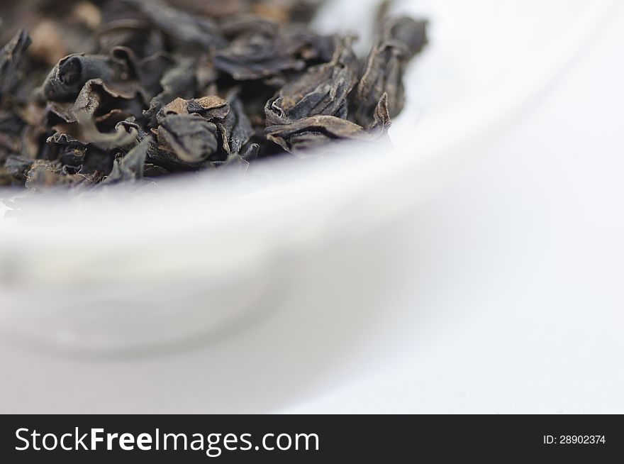 Dry Tea Leaves On A White Background