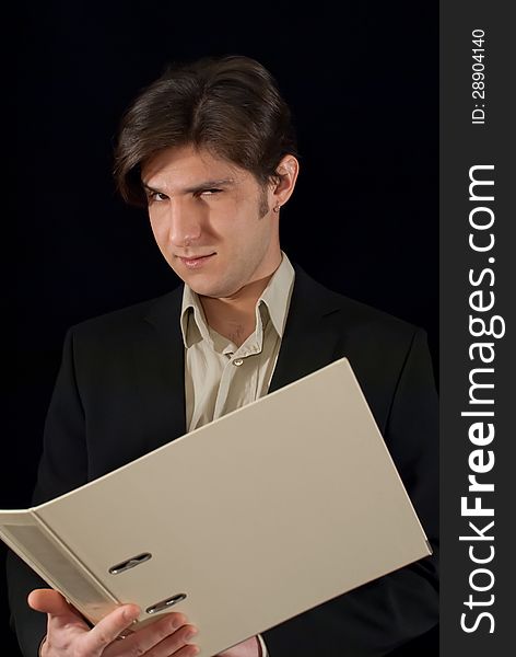 Young good looking man holding folder with documents