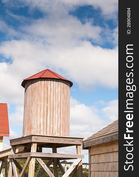 Old fashioned wooden water tower in the summer. Old fashioned wooden water tower in the summer