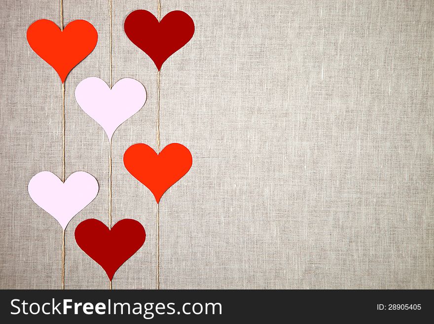 Valentine hearts garlands on linen background