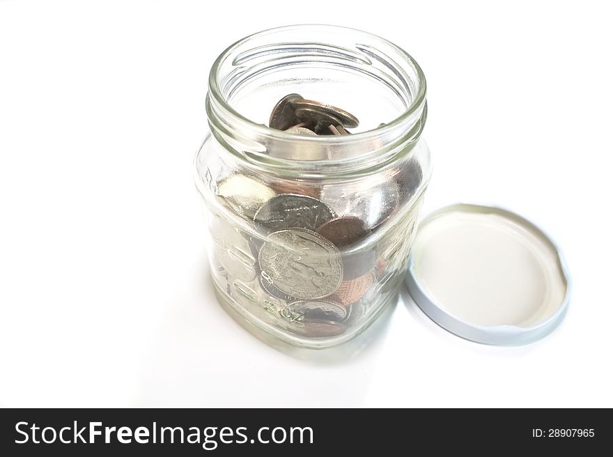 Open jar with coins inside. Open jar with coins inside