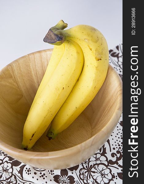Bunch of rip bananas in wooden bowl. Bunch of rip bananas in wooden bowl