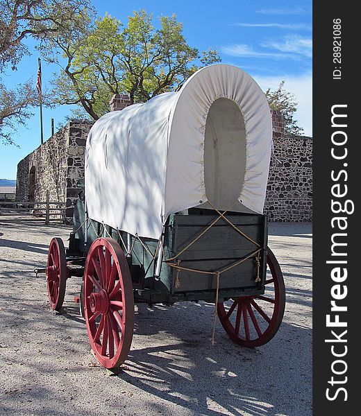 Functional replica of a pioneer era covered wagon used to settle the western United States in the 1800's. The wagon is located in Cove Fort, UT.