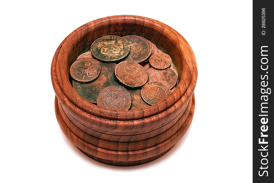 Ancient, unique coins in wooden pot isolated on white background. Ancient, unique coins in wooden pot isolated on white background