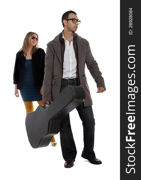 Musician and girlfriend walking behind him. Musician and girlfriend walking behind him