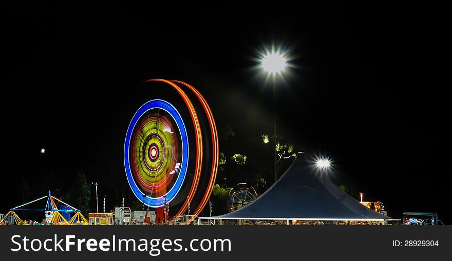 Night carnival with spinning wheel light. Night carnival with spinning wheel light
