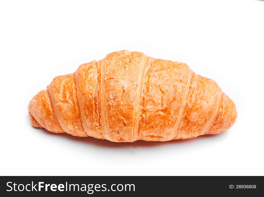 Delicious croissant on a white background