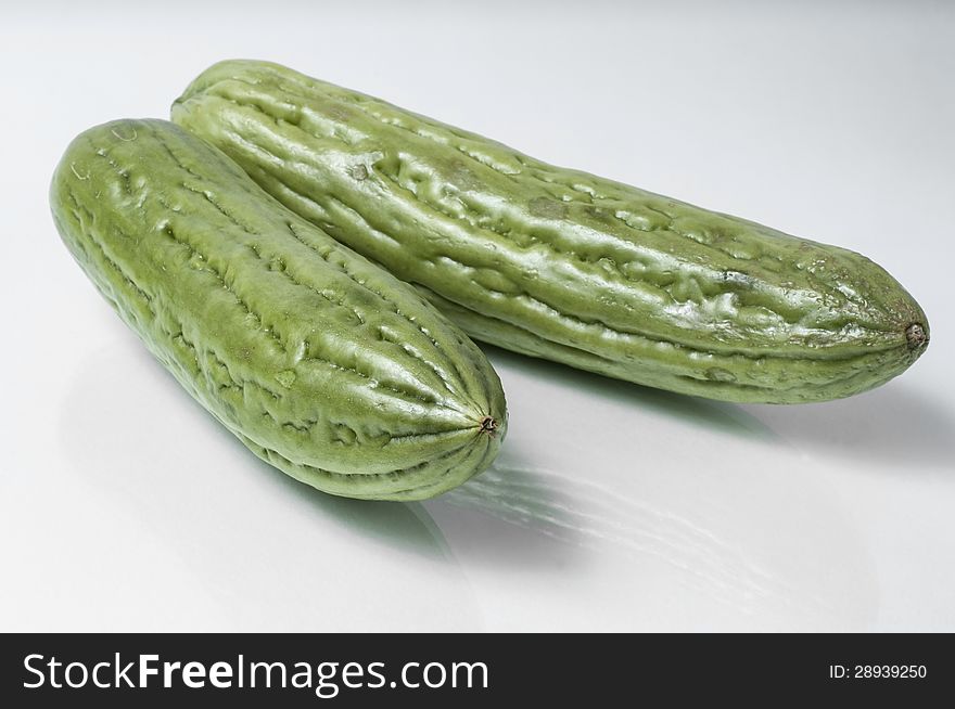 Two pice bitter melon on a white background