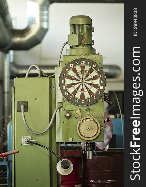 Darts board hanging on a drill machine. Darts board hanging on a drill machine