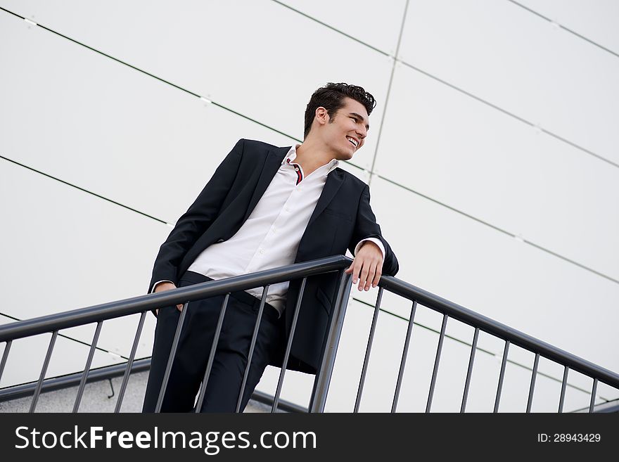 Portrait of a young businessman in an office building. Portrait of a young businessman in an office building