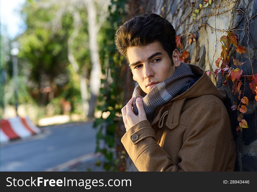 Attractive Young Handsome Man, Model Of Fashion In A Park