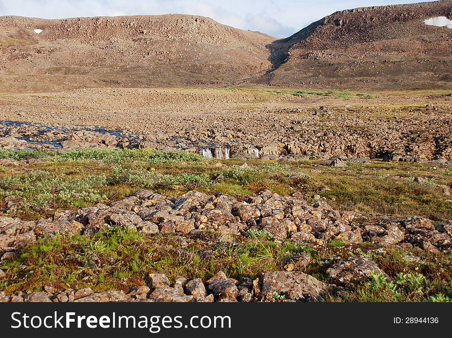 Rocky landscape on the Putorana plateau. The origins of the river Bucharama. Russia, Taimyr Peninsula. Rocky landscape on the Putorana plateau. The origins of the river Bucharama. Russia, Taimyr Peninsula.