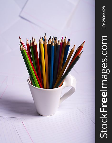 Many Color Pencils Standing In A White Mug